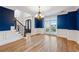 Beautifully appointed dining room with elegant lighting, hardwood floors, and views of the front yard at 2195 Lake Shore Lndg, Alpharetta, GA 30005