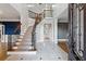 Elegant foyer with marble floors, grand staircase, and exquisite iron railing details at 2195 Lake Shore Lndg, Alpharetta, GA 30005