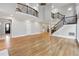 Expansive living room boasting hardwood floors, neutral walls, and open staircase at 2195 Lake Shore Lndg, Alpharetta, GA 30005