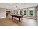 Game room with a pool table and great natural light at 2195 Lake Shore Lndg, Alpharetta, GA 30005
