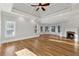 Sunlit main bedroom with tray ceiling, fireplace and hardwood floors at 2195 Lake Shore Lndg, Alpharetta, GA 30005