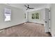 Bedroom featuring natural light, neutral walls, carpet, and modern ceiling fan at 1664 Crestridge Se Dr, Marietta, GA 30067