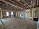 Spacious unfinished room with exposed ceiling beams, waiting for customization to create your dream living space at 1664 Crestridge Se Dr, Marietta, GA 30067