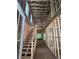 Unfinished interior showcasing exposed framing, a staircase, and natural light filtering through the windows at 1664 Crestridge Se Dr, Marietta, GA 30067