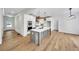 Modern kitchen with stainless steel appliances, white cabinets, a center island, and hardwood floors at 1664 Crestridge Se Dr, Marietta, GA 30067