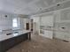 Kitchen with white cabinets, a gray island, and modern design elements at 1664 Crestridge Se Dr, Marietta, GA 30067