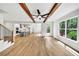 Spacious living room with hardwood floors, open floor plan, fireplace, and natural light at 1664 Crestridge Se Dr, Marietta, GA 30067