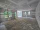 View of unfinished living room with multiple windows and access to a deck at 1664 Crestridge Se Dr, Marietta, GA 30067