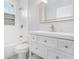 Bright bathroom featuring vanity with drawers, a shower-tub combo, and a window at 1220 Hightower Nw Rd, Atlanta, GA 30318