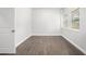 Bedroom with hardwood floors, a bright window, and white trim at 1220 Hightower Nw Rd, Atlanta, GA 30318