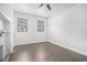 Bedroom with hardwood floors, a fireplace, and multiple windows at 1220 Hightower Nw Rd, Atlanta, GA 30318