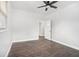 Bedroom with hardwood floors, ceiling fan, and a view into the next room at 1220 Hightower Nw Rd, Atlanta, GA 30318