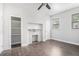 Bedroom featuring hardwood floors, natural light, closet with shelving, and a fireplace at 1220 Hightower Nw Rd, Atlanta, GA 30318