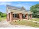 Charming brick home with a covered front porch, showcasing its architectural details at 1220 Hightower Nw Rd, Atlanta, GA 30318