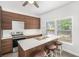 Eat in Kitchen features stylish cabinets and a large breakfast bar with seating for guests at 1220 Hightower Nw Rd, Atlanta, GA 30318