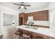 Modern kitchen flows into a living room, featuring a breakfast bar and stylish cabinets at 1220 Hightower Nw Rd, Atlanta, GA 30318