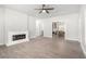 Open-concept living room with a decorative fireplace and views into the kitchen at 1220 Hightower Nw Rd, Atlanta, GA 30318