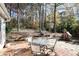 Patio furniture in backyard with wooded area at 1111 Valley Ridge Se Ct, Marietta, GA 30067