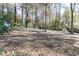 Wooded backyard with a shed and fence at 1111 Valley Ridge Se Ct, Marietta, GA 30067