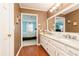 Double vanity bathroom with granite countertops and access to bedroom at 1111 Valley Ridge Se Ct, Marietta, GA 30067