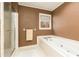 Bathroom with a large bathtub and a separate shower at 1111 Valley Ridge Se Ct, Marietta, GA 30067