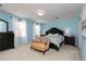 Spacious bedroom with light blue walls and a comfortable sitting area at 1111 Valley Ridge Se Ct, Marietta, GA 30067