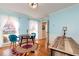 Bright dining room with light blue walls, round table, and workspace at 1111 Valley Ridge Se Ct, Marietta, GA 30067