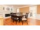 Bright dining room with hardwood floors, built-in shelving, and fireplace at 1111 Valley Ridge Se Ct, Marietta, GA 30067