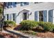 House entrance with dark door, brick steps, and well-maintained shrubs at 1111 Valley Ridge Se Ct, Marietta, GA 30067