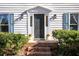 Dark-stained front door with sidelights and brick steps at 1111 Valley Ridge Se Ct, Marietta, GA 30067