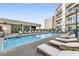 Relaxing rooftop pool area with lounge chairs and city views at 1100 Howell Mill Nw Rd # 304, Atlanta, GA 30318