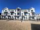 Exterior view of townhomes with modern design at 522 Healy Dr # 66, Cumming, GA 30040