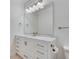 Modern bathroom with white vanity, marble countertop, and a large mirror at 1122 Westchester Ne Rdg, Atlanta, GA 30329