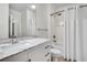 Clean bathroom with marble vanity, bathtub, and shower at 1122 Westchester Ne Rdg, Atlanta, GA 30329