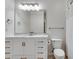 Clean bathroom with white vanity, marble countertop, and a large mirror at 1122 Westchester Ne Rdg, Atlanta, GA 30329