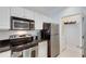 Modern kitchen with stainless steel appliances and pantry at 1122 Westchester Ne Rdg, Atlanta, GA 30329