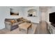 Spacious living room with hardwood floors and a comfortable sectional sofa at 1122 Westchester Ne Rdg, Atlanta, GA 30329