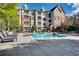 Inviting pool area with lounge chairs and building view at 1122 Westchester Ne Rdg, Atlanta, GA 30329