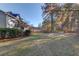 Spacious backyard with mature trees and a large grassy area at 1750 Terrace Lake Dr, Lawrenceville, GA 30043