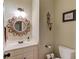 Charming bathroom with unique mirror and decorative accents at 1750 Terrace Lake Dr, Lawrenceville, GA 30043