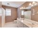 Bathroom with double sinks, shower, and patterned wallpaper at 1750 Terrace Lake Dr, Lawrenceville, GA 30043