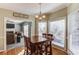 Kitchen dining area with table and chairs, view to living room at 1750 Terrace Lake Dr, Lawrenceville, GA 30043