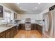 Two-toned kitchen with granite countertops and stainless steel appliances at 1750 Terrace Lake Dr, Lawrenceville, GA 30043