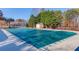 Community pool with green cover, surrounded by trees at 1750 Terrace Lake Dr, Lawrenceville, GA 30043