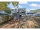 Backyard view with shed, fenced yard, and mature trees at 361 W Post Oak Sw Xing, Marietta, GA 30008