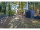 Large backyard with shed, chain link fence, and lush greenery at 361 W Post Oak Sw Xing, Marietta, GA 30008