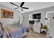 Bedroom with hardwood floors, ceiling fan, and mounted TV at 361 W Post Oak Sw Xing, Marietta, GA 30008