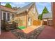 Brick backyard with stone steps, privacy fence, and outdoor shower at 4738 Ivy Ridge Se Dr, Atlanta, GA 30339