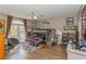 Fun bedroom featuring a bunk bed, light hardwood floors, a ceiling fan and curtains over the french doors at 4738 Ivy Ridge Se Dr, Atlanta, GA 30339