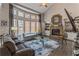 Cozy living room featuring a fireplace, bay window, and comfortable seating at 4738 Ivy Ridge Se Dr, Atlanta, GA 30339